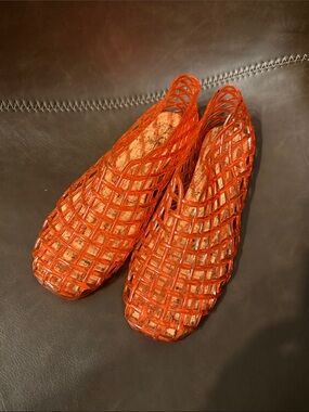 New with tags. Nicole Miller orange jelly flats